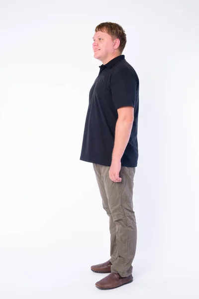 Full body shot profil syn på Happy övervikt man leende — Stockfoto
