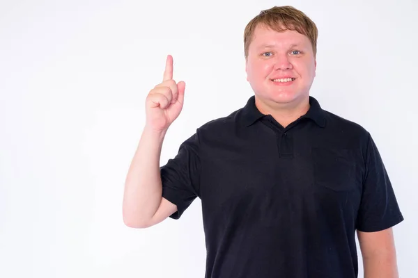Mutlu kilolu adam portresi yukarı işaret — Stok fotoğraf