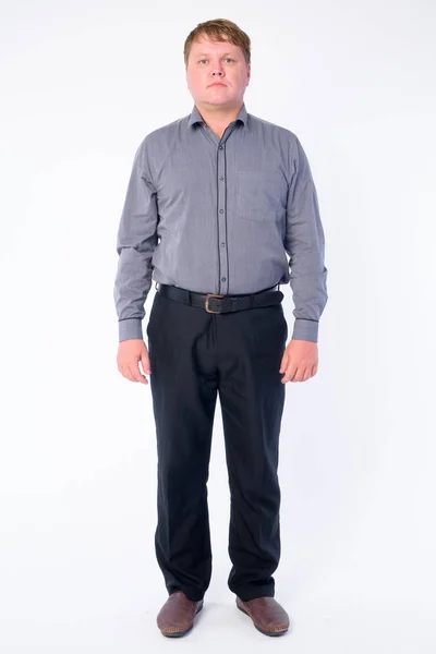 Full body shot of overweight businessman looking at camera — Stock Photo, Image