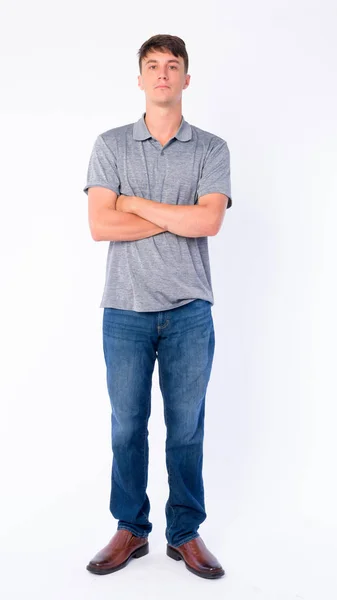 Full body shot of young handsome man with arms crossed — Stock Photo, Image