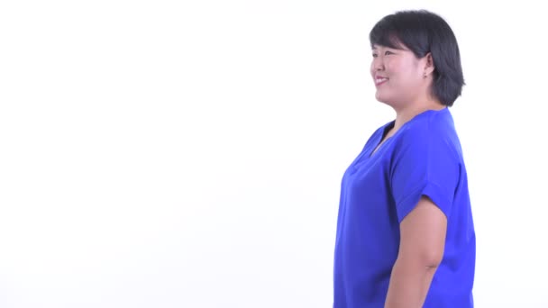 Perfil de la feliz mujer de negocios asiática con sobrepeso sonriendo — Vídeos de Stock