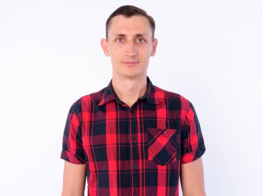 Studio shot of hipster man wearing red checkered shirt isolated against white background