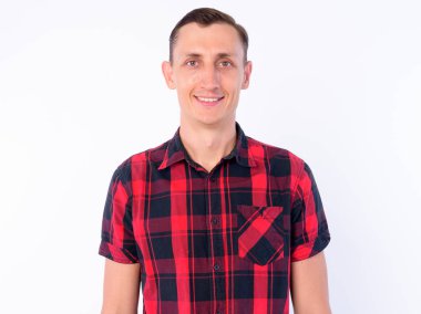 Studio shot of hipster man wearing red checkered shirt isolated against white background