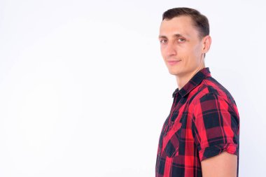 Studio shot of hipster man wearing red checkered shirt isolated against white background