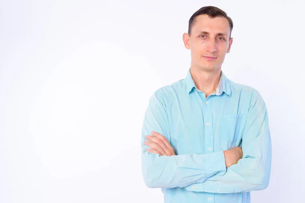 Studio shot of businessman with arms crossed — Stock Photo, Image