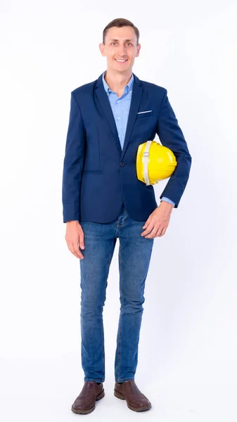 Full body shot of happy businessman in suit as engineer smiling — Stock Photo, Image