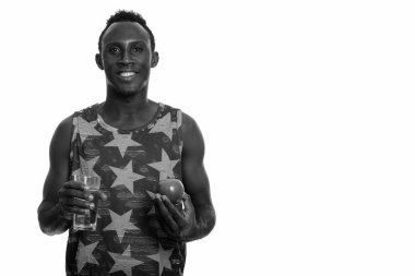 Black and white studio portrait of young African man