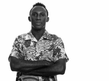 Black and white studio portrait of young African man