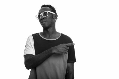 Black and white studio portrait of young African man