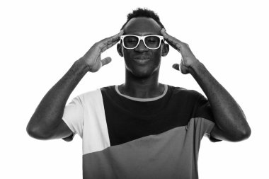 Black and white studio portrait of young African man