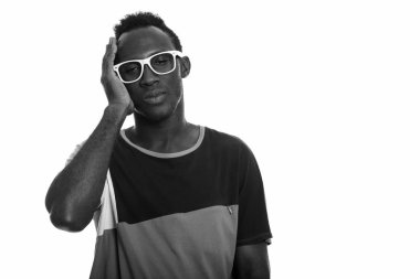Black and white studio portrait of young African man