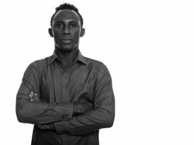 Black and white studio portrait of young African man