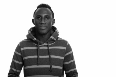 Black and white studio portrait of young African man