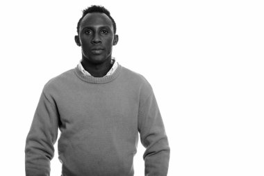 Black and white studio portrait of young African man
