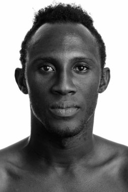 Black and white studio portrait of young African man