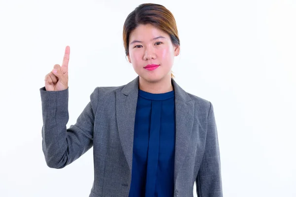 Retrato de joven hermosa mujer de negocios asiática señalando hacia arriba —  Fotos de Stock