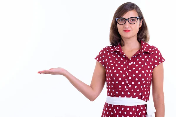 Portrait of beautiful woman with eyeglasses showing something — 스톡 사진