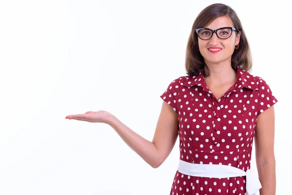 Portrait of happy beautiful woman with eyeglasses showing something — 스톡 사진