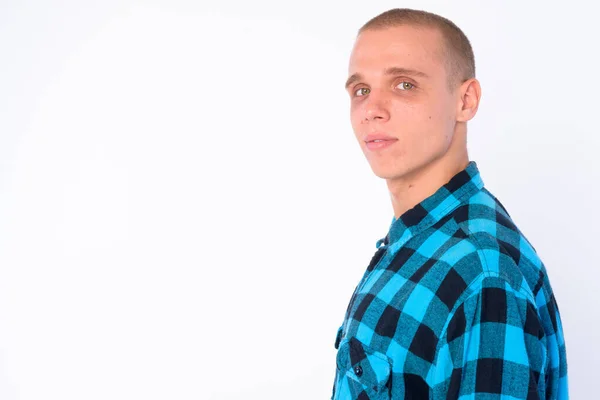 Closeup profile view of young bald hipster man looking at camera — Stock Photo, Image