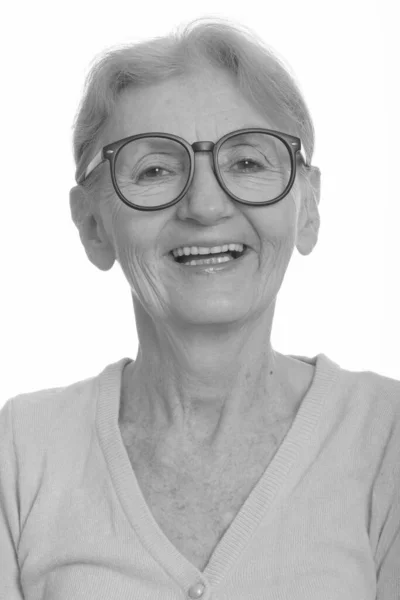 Face of happy senior nerd woman smiling while wearing geeky eyeglasses — Stock Photo, Image