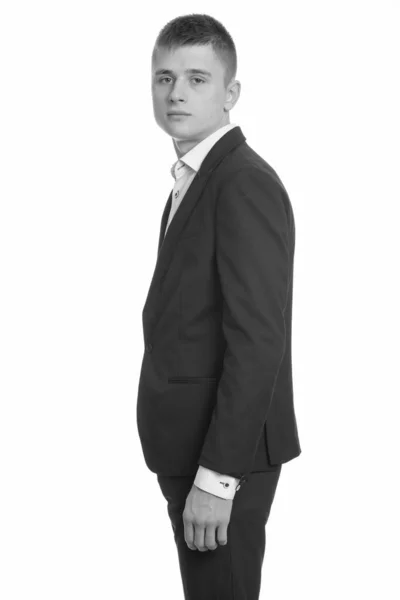 Studio shot of young businessman in black and white — Stock Photo, Image