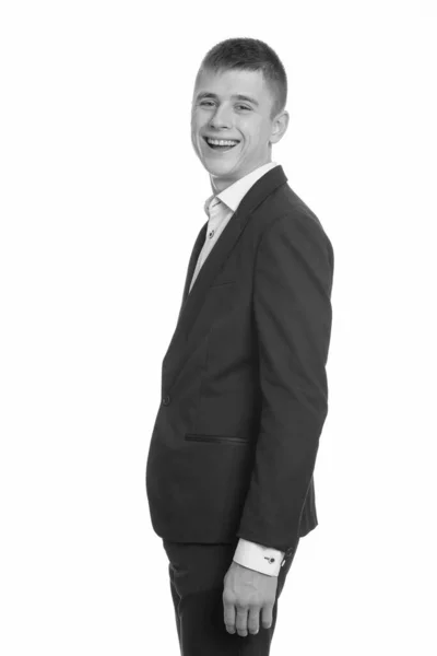 Studio shot of young happy businessman smiling — Stock Photo, Image