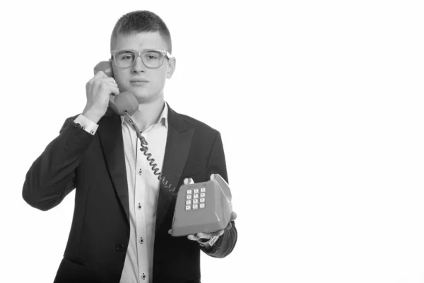 Estúdio tiro de jovem empresário falando no telefone antigo — Fotografia de Stock