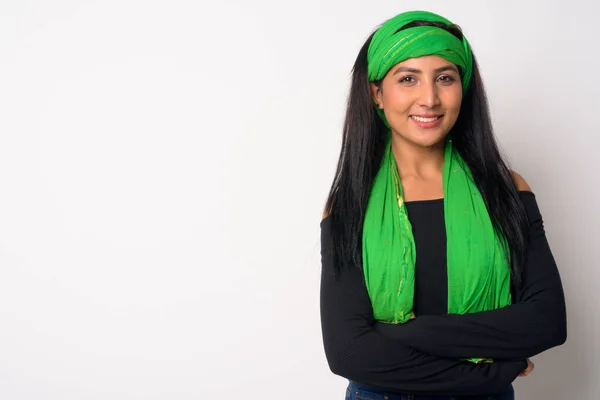 Happy young beautiful Persian woman smiling with arms crossed — Stock Photo, Image