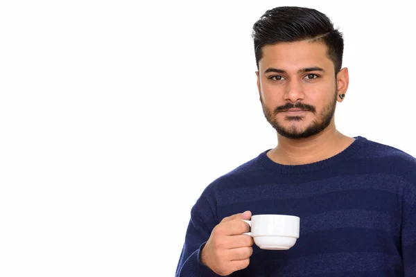 Young handsome Indian man holding coffee cup — Stock Photo, Image