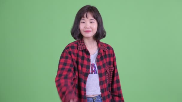 Happy Asian hipster woman giving handshake — ストック動画