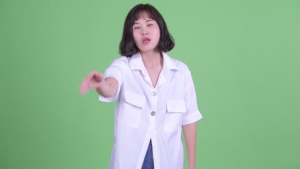 Stressed Asian businesswoman with stop gesture — Stock Video