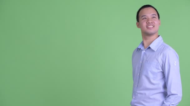 Profil pohled na šťastný asijský podnikatel s úsměvem — Stock video