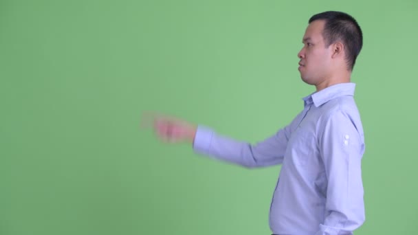 A következő profilképe: happy Asian businessman point finger — Stock videók