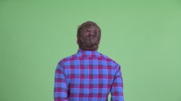 Rear view of happy overweight bearded hipster man with fists raised — Stock Video