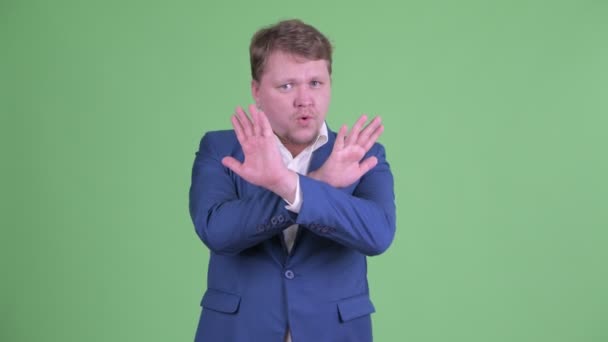 Serious overweight bearded businessman with stop gesture — Stock Video