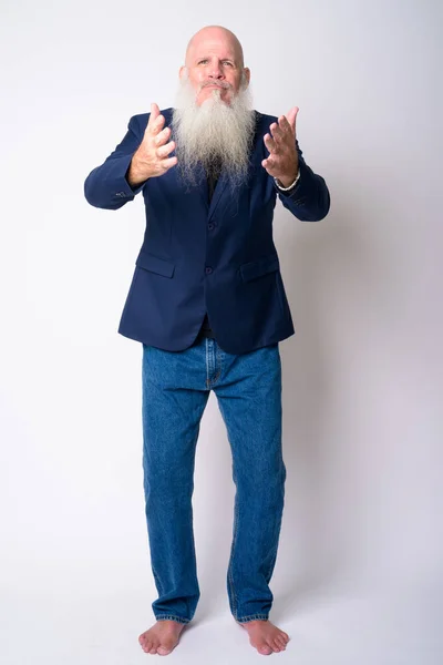 Full body shot of mature bearded bald businessman looking confused — Stock Photo, Image