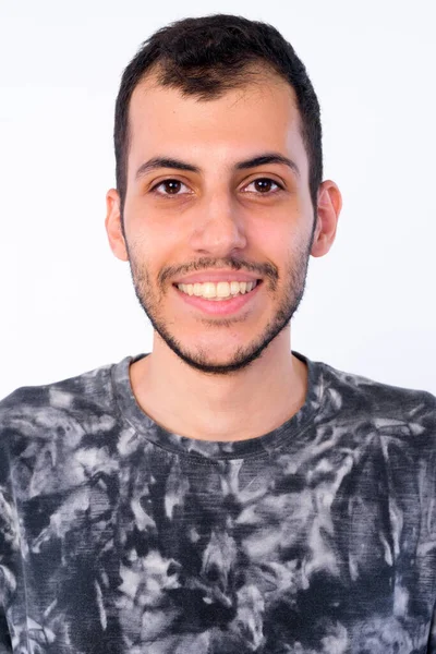 Face of happy young bearded Persian man smiling — Stock Photo, Image