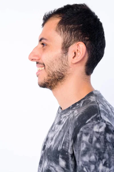 행복한 젊은 수염 페르시아 남자의 클로즈업 프로필보기 미소 — 스톡 사진