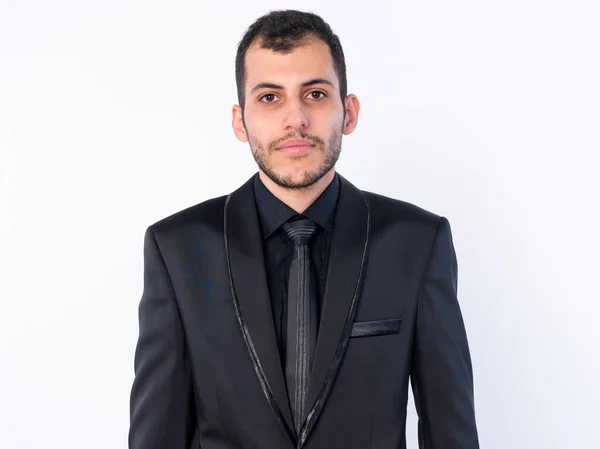 Rostro de joven hombre de negocios persa barbudo en traje — Foto de Stock
