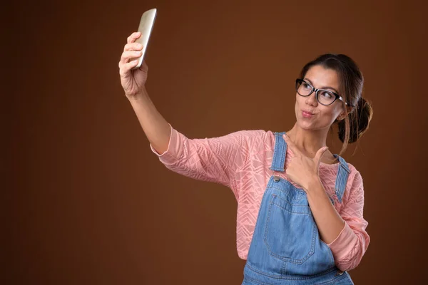 Portrait of beautiful multi ethnic nerd woman using phone — Stock Photo, Image