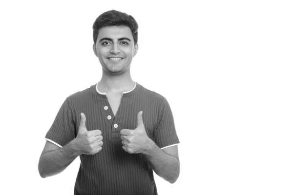 Mladý šťastný perský muž dává palce nahoru — Stock fotografie