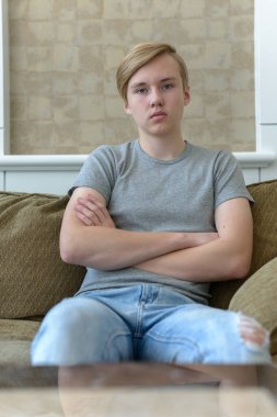 Portrait of young handsome blond teenage boy
