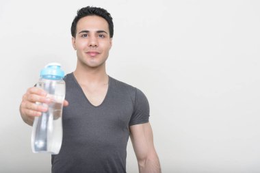 Studio shot of young muscular handsome man 