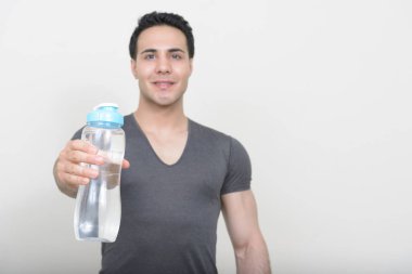 Studio shot of young muscular handsome man 