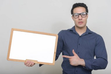 Studio shot of young muscular handsome man 