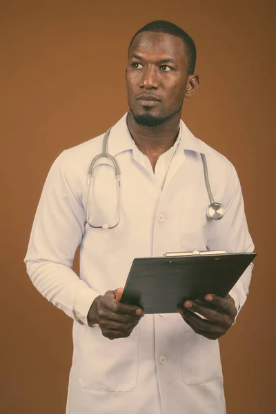 Studio Shot Handsome African Man Doctor Brown Background — Stock Photo, Image