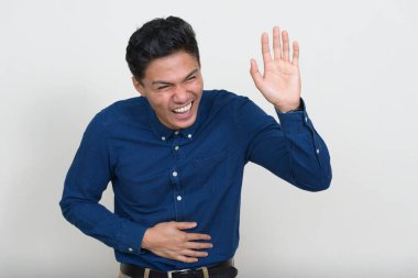 Studio shot of handsome Filipino businessman against white background