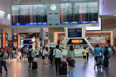 KUALA LUMPUR, MALAYSIA - FEBRUARY 20, 2017 - People at departure area of Kuala Lumpur International Airport known as Malaysia's main international airport