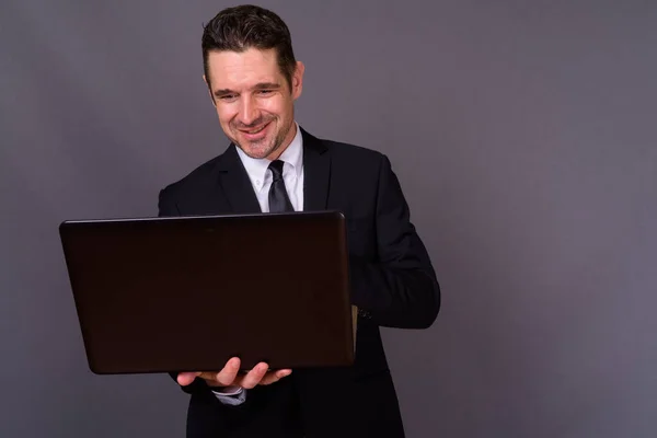 Studio Shot Handsome Bearded Businessman Suit Gray Background — Stock Photo, Image