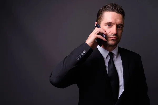 Studio Shot Handsome Bearded Businessman Suit Gray Background — Stock Photo, Image